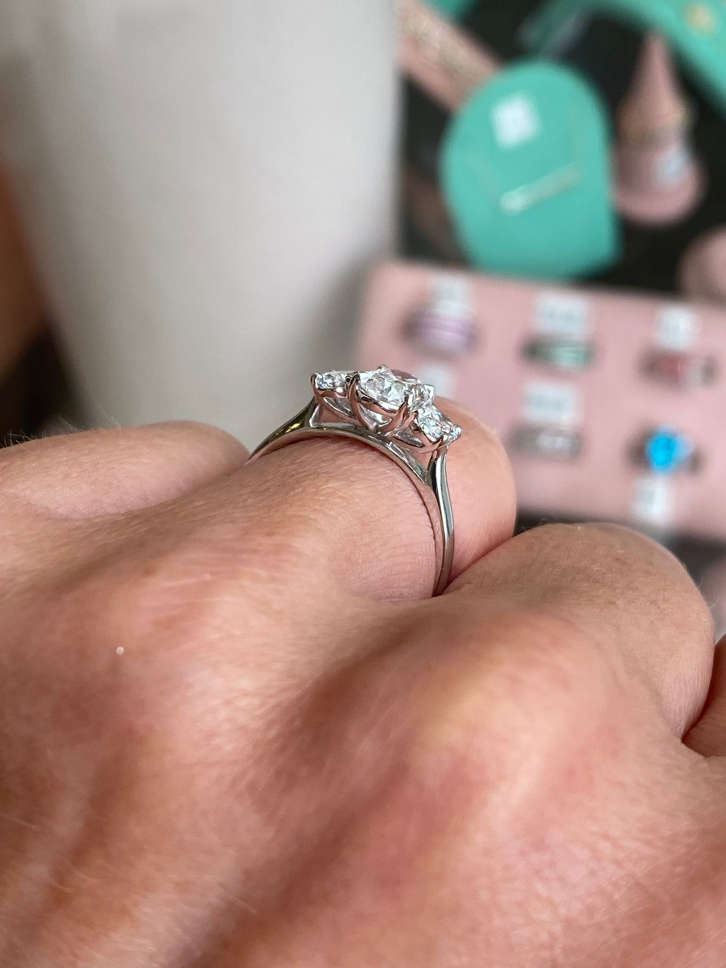 TCA platinum oval trilogy engagement ring with 1.59ct lab-certified diamonds, showcasing a sleek and elegant design.
