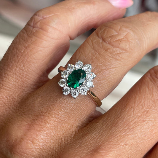 9ct gold lab-grown oval cluster ring with emeralds, featuring a 5x7mm oval centerpiece, by PJD.