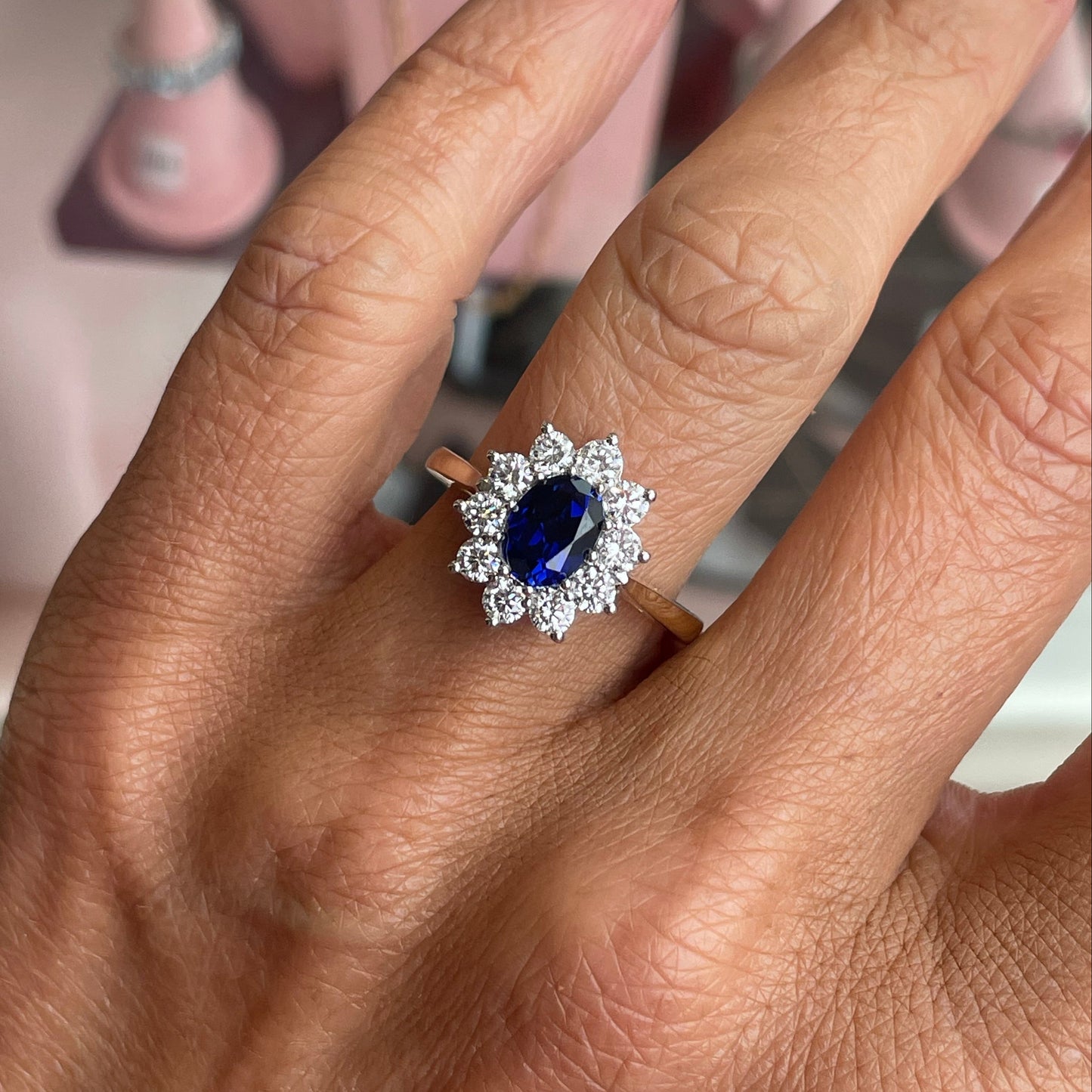 9ct gold lab-grown oval sapphire cluster ring featuring a 6x8mm sapphire, crafted by PJD with elegant design.
