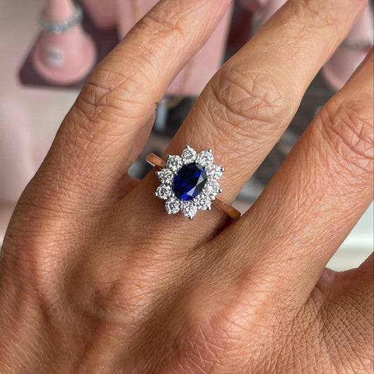 9ct gold lab-grown oval sapphire cluster ring featuring a 6x8mm sapphire, crafted by PJD with elegant design.