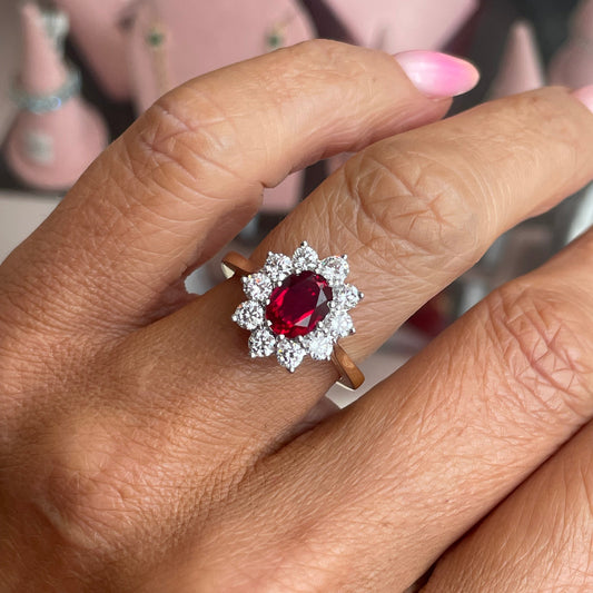 9ct gold lab-grown oval cluster ring with ruby accents by PJD, showcasing a detailed close-up of the jewelry design.