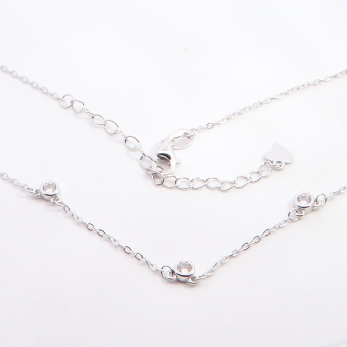 Silver CZ station necklace from Comero, 60+5cm length, featuring sparkling cubic zirconia stones on a sleek silver chain.