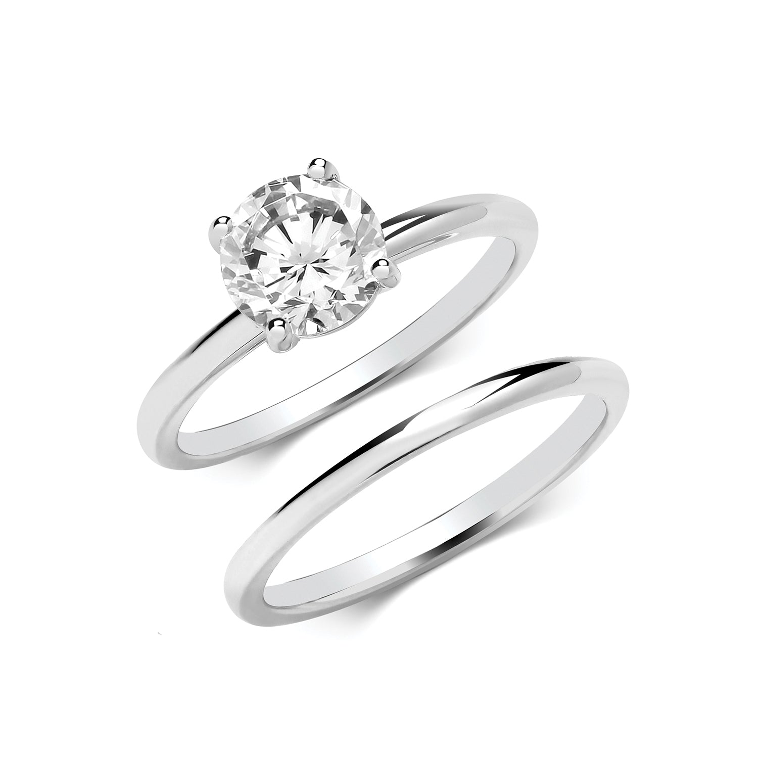 Silver CZ bridal ring set by THC featuring sparkling cubic zirconia stones on matching wedding bands.