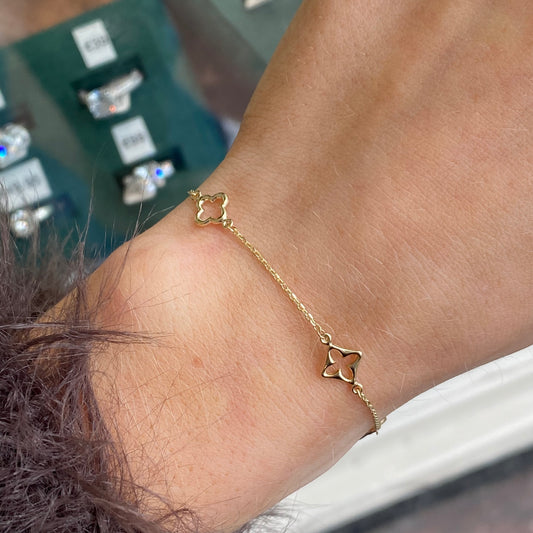 Mark Milton 9ct gold quatrefoil bracelet with linked four-leaf clover charms
