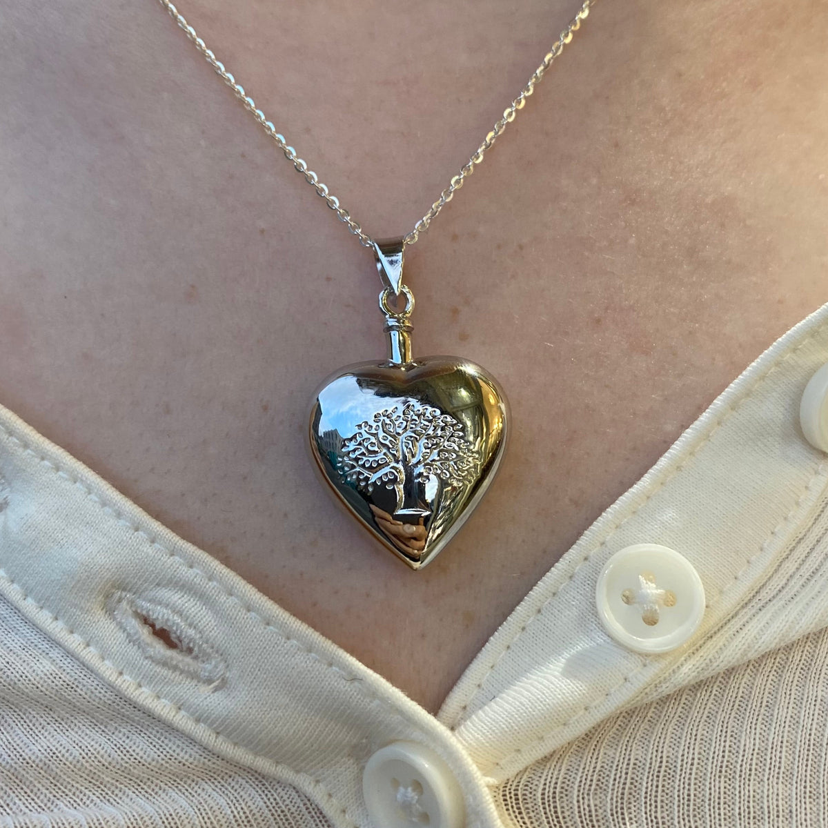 Insignia silver Tree of Life heart ash locket necklace with intricate tree design on pendant