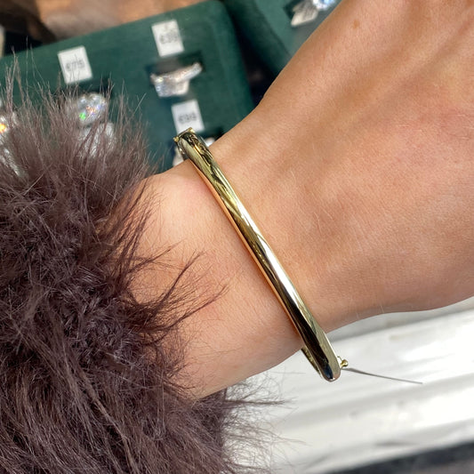 Mark Milton 9ct gold domed polished bangle with a smooth rounded finish