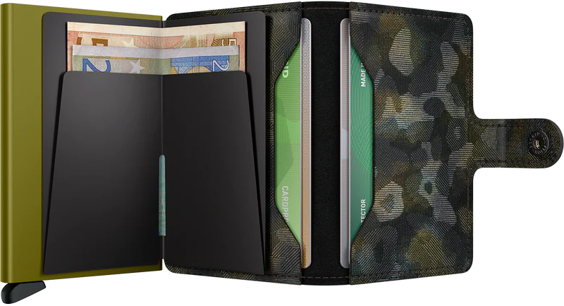 Secrid Miniwallet Jungle Moss open showing card slots and cash compartment in vibrant moss green leather.