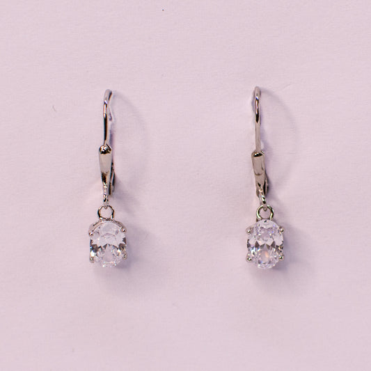 Silver oval CZ drop earrings with German wires from Insignia, featuring sparkling cubic zirconia stones and elegant design.