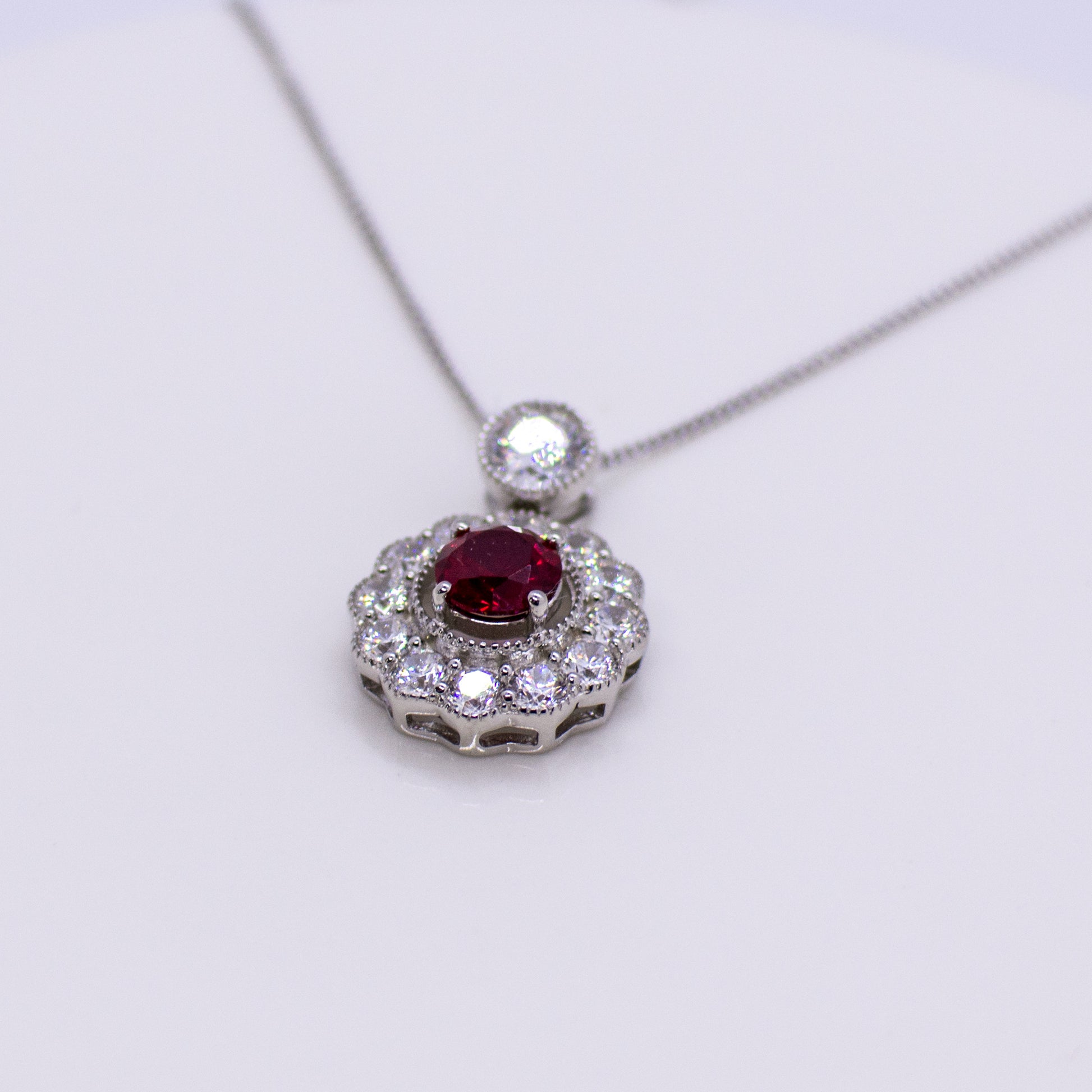 Silver Created Ruby CZ Halo Necklace - John Ross Jewellers