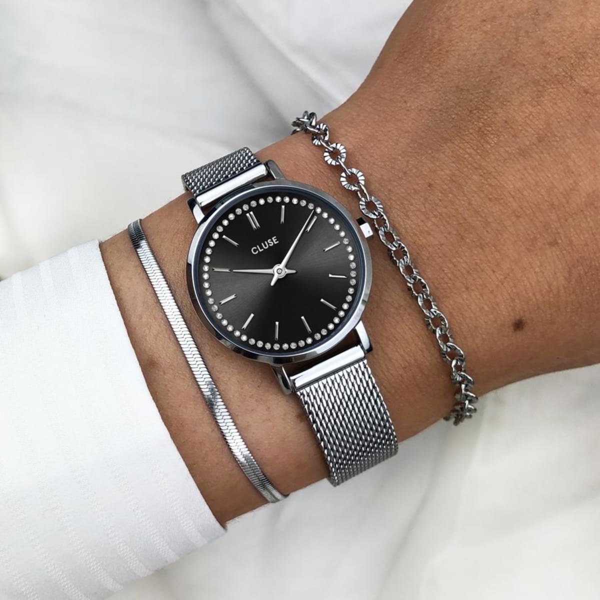 Small size, big dreams. With its refined 28 mm case, our Boho Chic Petite collection is your perfect companion if you prefer a smaller timepiece. Featuring a chic black dial, enchanting crystal embellishments and a timeless silver coloured case and strap. This watch will complement every look. Thanks to its stainless steel case and mesh strap, this watch is built to last.