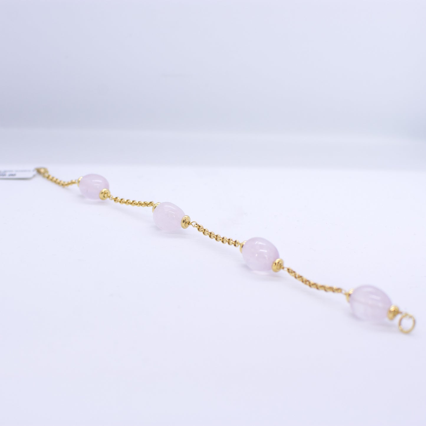 18ct Gold Silky Rose Quartz and Chain Bracelet Rose Quartz dimensions: 10mm x 12mm approximately Diamond cut 2mm gauge solid trace chain 19cm long 18ct yellow gold This item can be ordered in a variety of lengths.  Please contact us for custom requirements.
