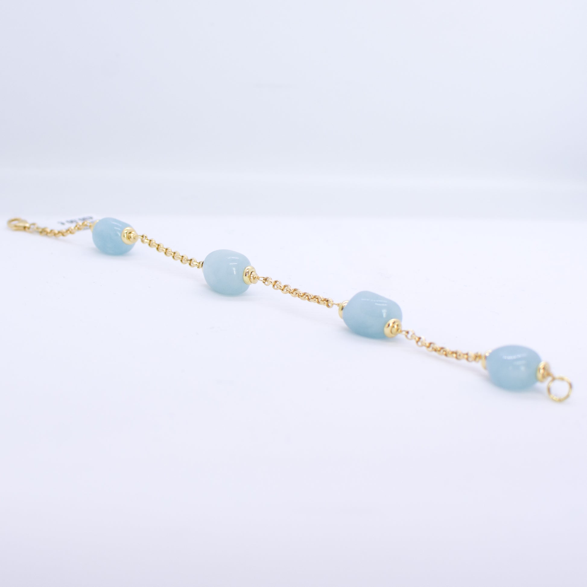 18ct Gold Silky Aquamarine and Chain Bracelet Aquamarine dimensions: 10mm x 12mm approximately Diamond cut 2mm gauge solid trace chain 19cm long 18ct yellow gold This item can be ordered in a variety of lengths.  Please contact us for custom requirements.