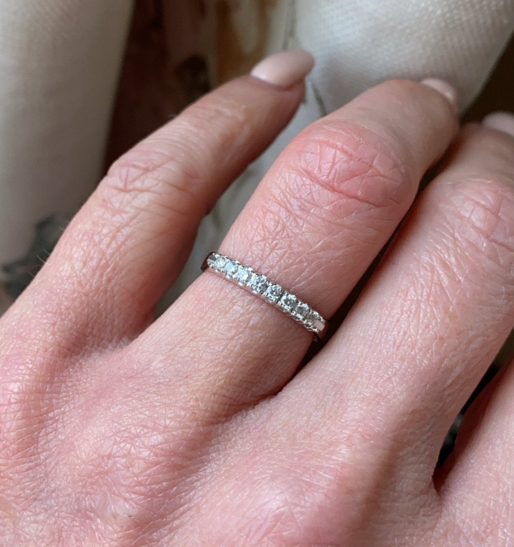 18ct white gold diamond eternity ring set with seven round brilliant cut diamonds. 0.18ct in total. G colour. VS clarity. 2.5mm diameter . This ring is suitable as a wedding band or eternity ring. Size M Other sizes by special order.