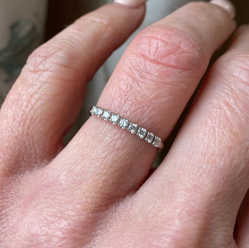 18ct white gold diamond eternity ring set with nine round brilliant cut diamonds. 0.18ct in total. G colour. VS clarity. 2mm diameter . This ring is suitable as a wedding band or eternity ring. Size M Other sizes by special order.