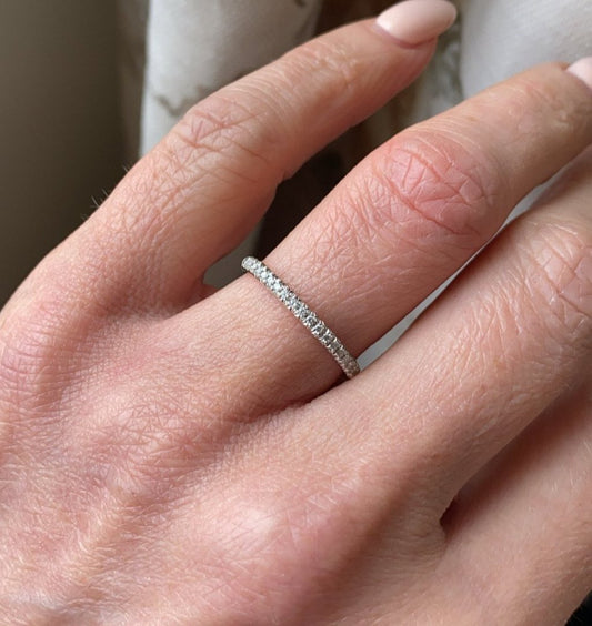 18ct white gold diamond eternity ring set with nineteen round brilliant cut diamonds. 0.12ct in total. G colour. VS clarity. 2mm diameter . This ring is suitable as a wedding band or eternity ring. Size O Other sizes by special order.