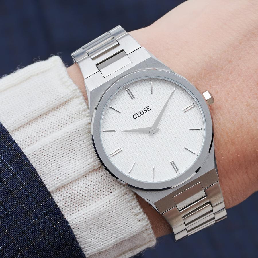 Strong. Bold. Beautiful. An integrated silver colour bracelet and multi-faceted case, combining brushed and highly polished elements. Upgrade your wrist game with this utterly chic stainless steel watch. Featuring a snow white grid dial and hint of joie de vivre. A celebration of your most powerful moments in life. Water resistance: 5 ATM. We will adjust the size of this strap in store.  