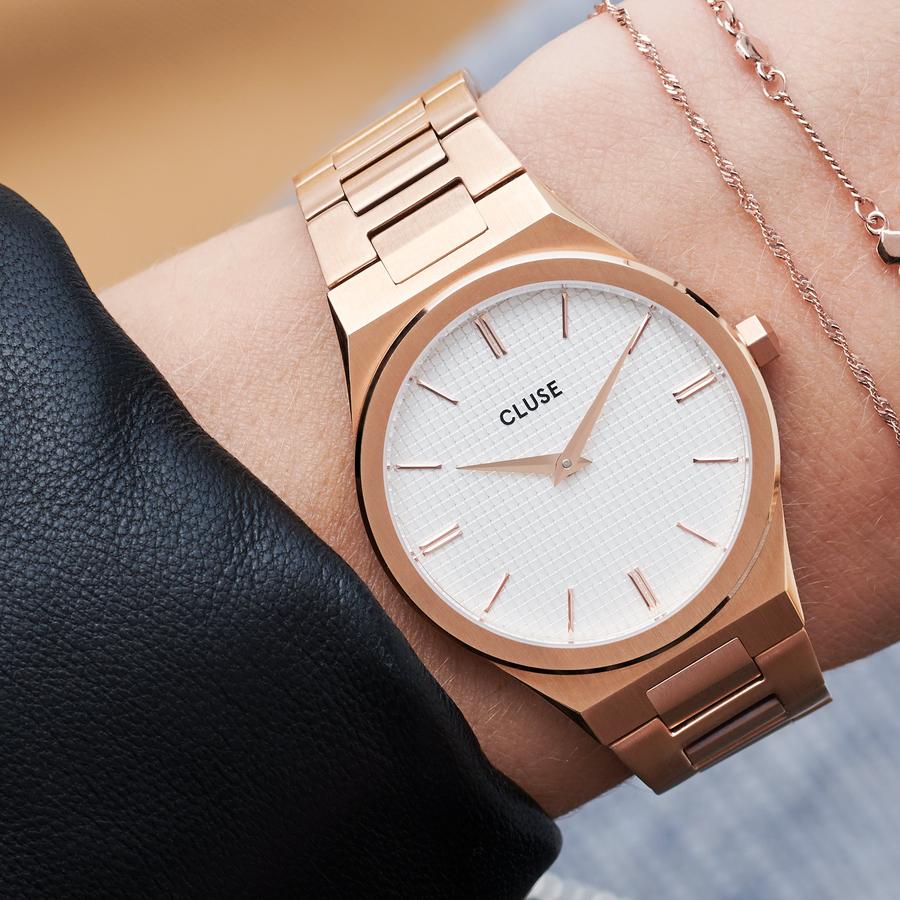 Strong. Bold. Beautiful. An integrated rose gold colour bracelet and multi-faceted case, combining brushed and highly polished elements. Upgrade your wrist game with this utterly chic stainless steel watch. Featuring a snow white grid dial and hint of joie de vivre. A celebration of your most powerful moments in life. Water resistance: 5 ATM. We will adjust the size of this strap in store.  