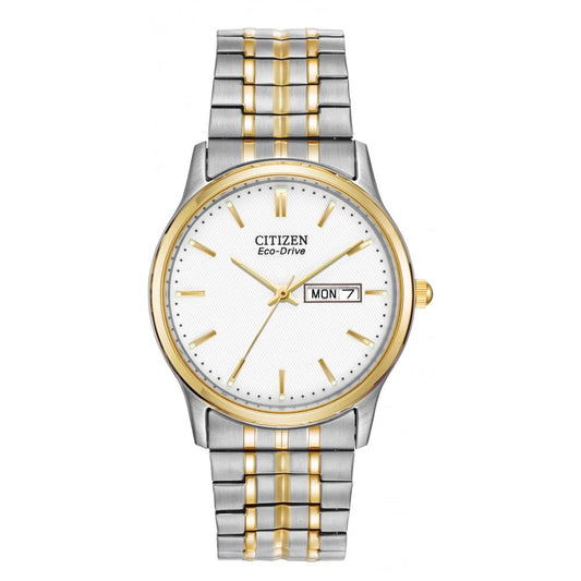 Stainless steel case with an expanding two-tone (silver & gold) stainless steel bracelet. Fixed gold-tone bezel. Silver dial with luminous gold-tone hands and stick hour markers. Minute markers around the outer rim. Day and date display at the 3 o'clock position. Japanese Quartz movement. Citizen Ecodrive, never requires a battery. The watch includes water resistance of 30 metres and a 36mm case.