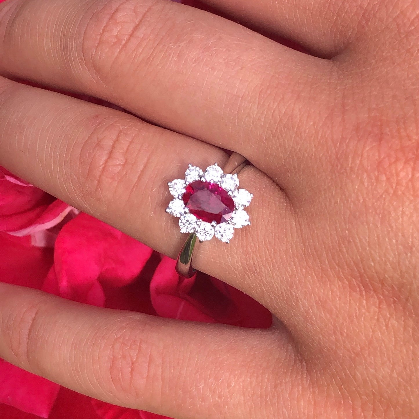 18ct white gold ruby and diamond oval cluster. Size N Other sizes and gemstones available to order