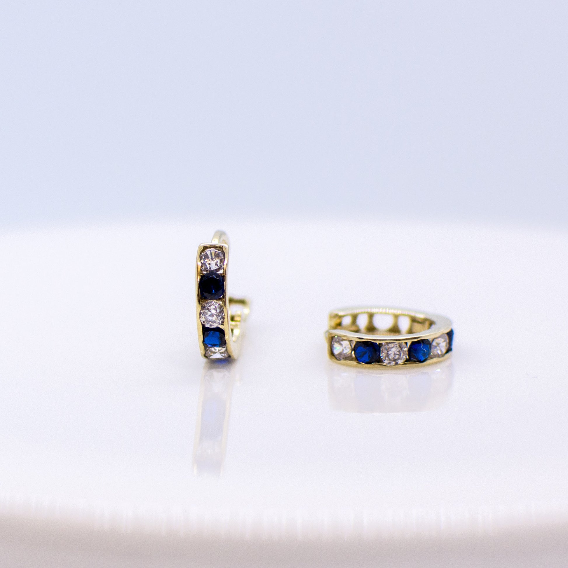 9ct Gold CZ Huggie Earrings - Blue & White - John Ross Jewellers