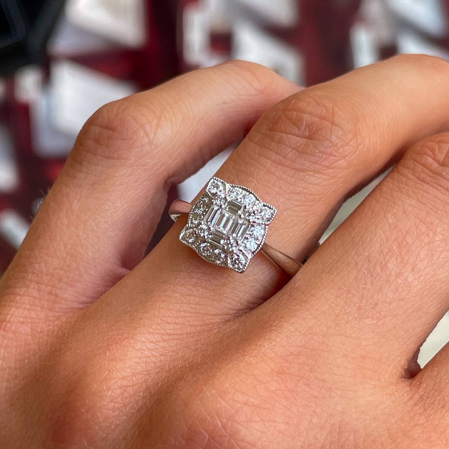 Ultra glam and super stylish.  Our Ciara ring features a beautiful cluster of baguette cut diamonds surrounded by a halo of round brilliant cut diamonds with exquisite vintage details.     0.21ct of baguette cut diamonds   0.25ct of round brilliant cut diamonds.  18ct White Gold