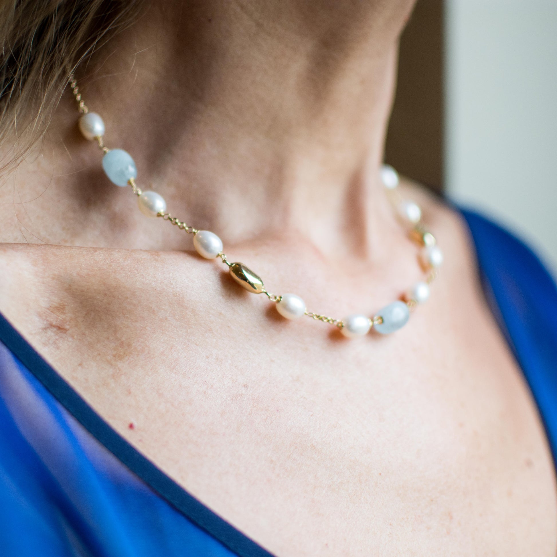 18ct Gold Silky Aquamarine and Cultured Freshwater Pearl Chain Necklace Pearl dimensions: 10mm x 8mm approximately Silky Aquamarine dimensions: 12mm x 10mm approximately 43cm long 18ct yellow gold This item can be ordered in a variety of lengths.  Please contact us for custom requirements.