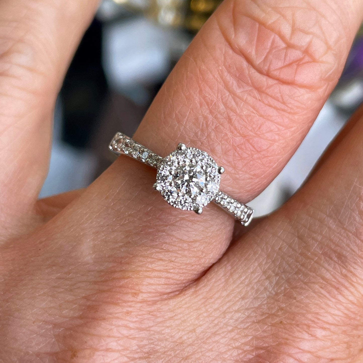 This solitaire cluster diamond engagement ring is a complete classic.  Its simplicity is so romantic.  The Details...  One 18ct white gold diamond engagement ring.  Cluster of brilliant cut diamonds.  0.65ct HSI  18ct white gold.  