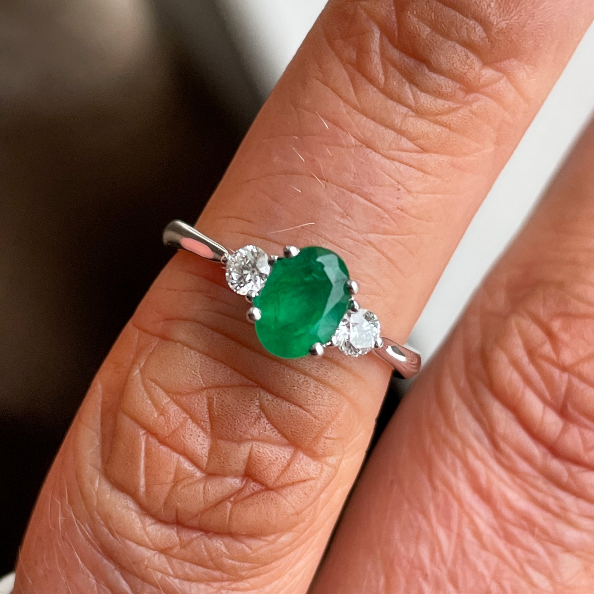 18ct White Gold Emerald & Diamond Engagement Ring | 0.81ct Oval cut Emerald  + 0.22ct of round brilliant cut diamonds 