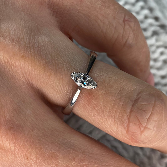This diamond engagement ring  is a complete classic.  Its simplicity is so romantic.  The Details...  One 18ct white gold diamond engagement ring.  A single Marquis cut diamond. Claw set. Diamond 0.40ct Colour FG.  Clarity SI  18ct white gold.  Size M 1/2  Made in Ireland